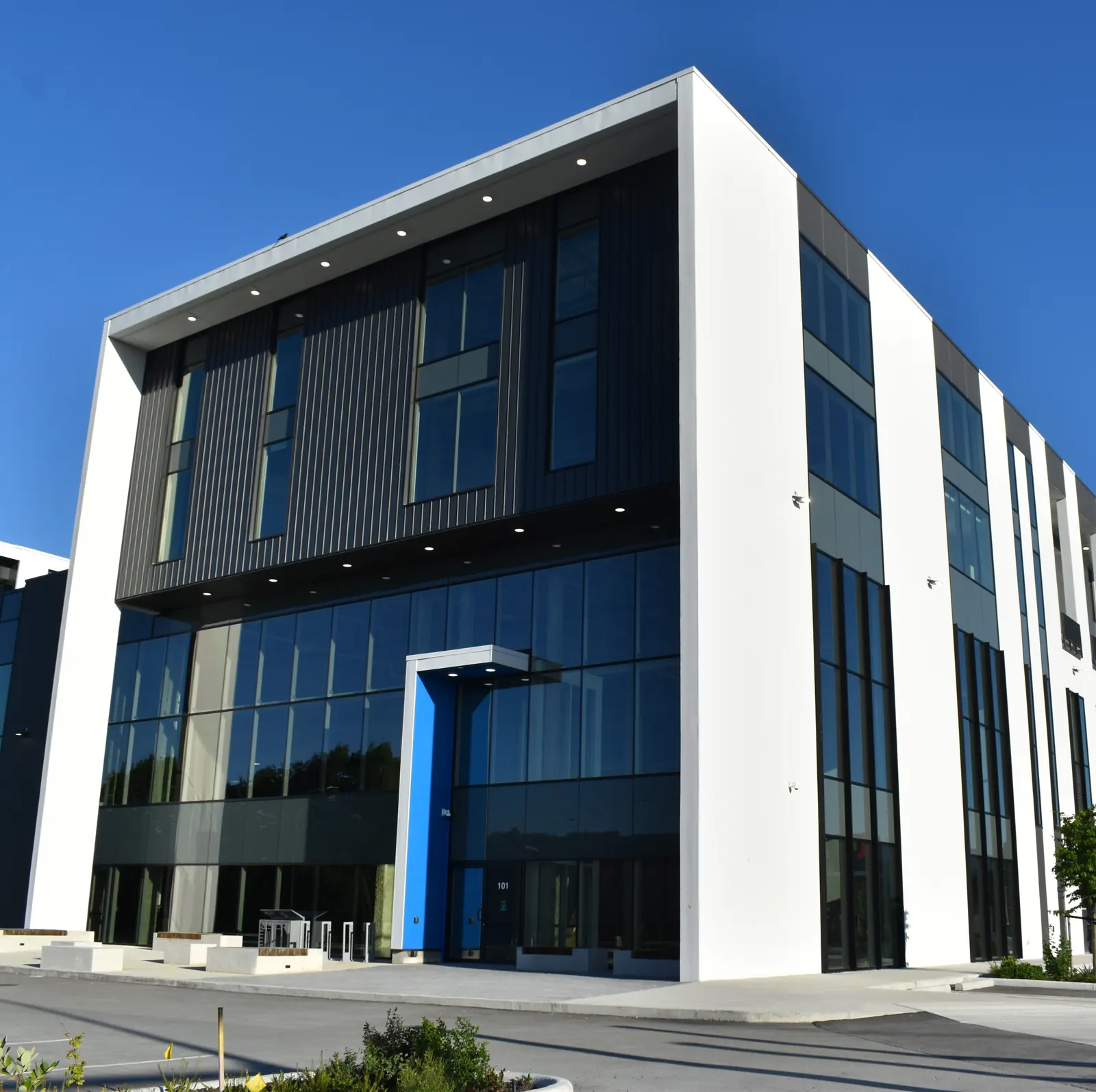King Ed 11: commercial exterior cladding in Coquitlam, BC by L2 Group — Corrugated metal & WHFH-12