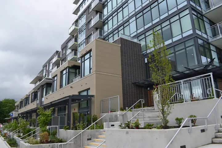 Cap West: high-rise exterior cladding in North Vancouver, BC by L2 Group — Nichiha panels