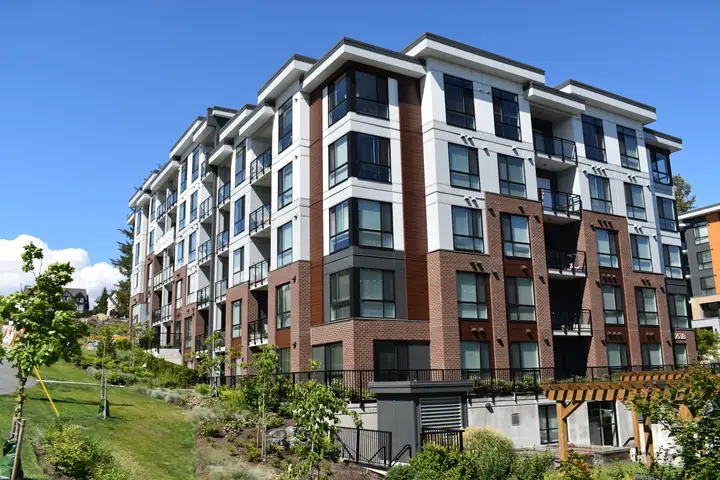 Duffy Hills: mid-rise exterior cladding in Langley, BC by L2 Group — Hardie panel, lap siding & Longboard