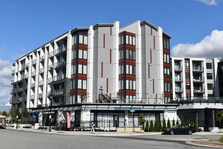 Genesis: mid-rise exterior cladding in Langley, BC by L2 Group — Corrugated metal