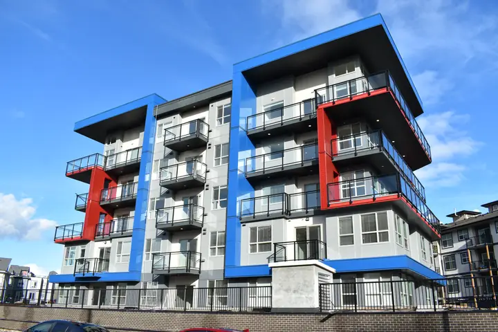 Skyline: mid-rise exterior cladding in Langley, BC by L2 Group — Corrugated metal & cementitious panels