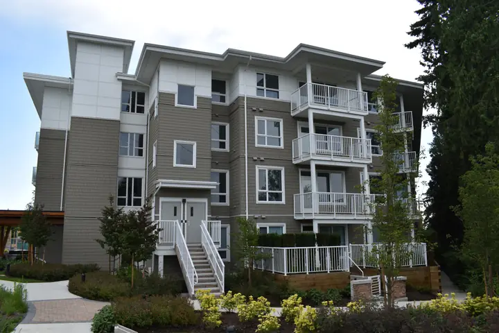 Sunstone: mid-rise exterior cladding in Delta, BC by L2 Group — Cementitious panels
